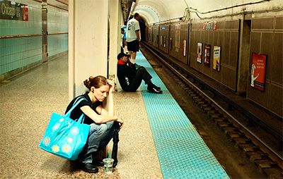 woman waiting at subway