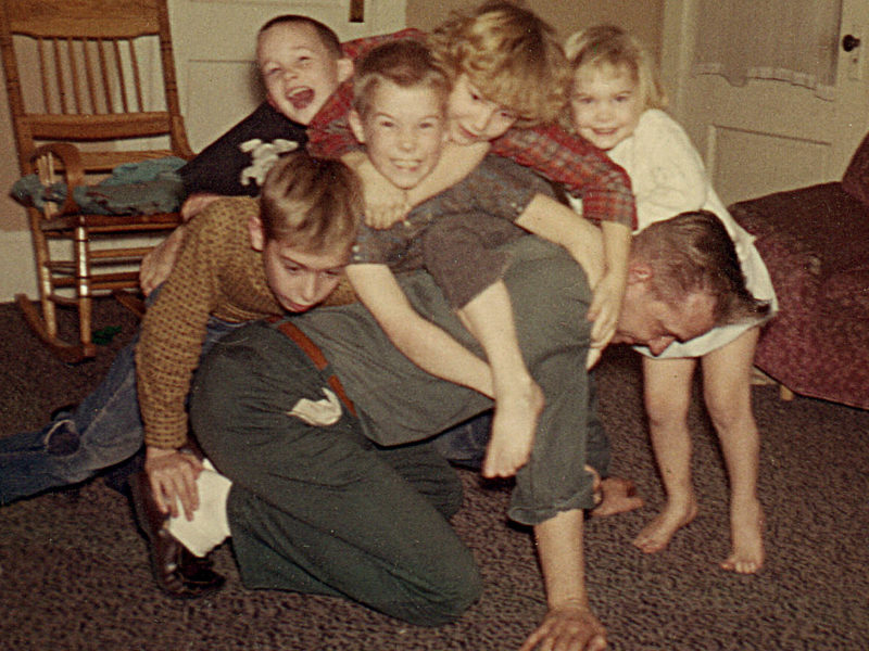 5 kids wrestling their dad