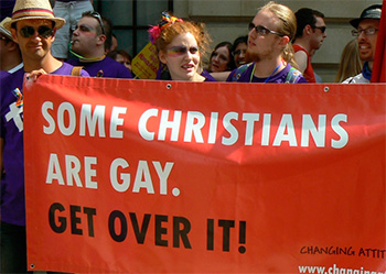 protesters holding banner that says some Christians are gay, get over it
