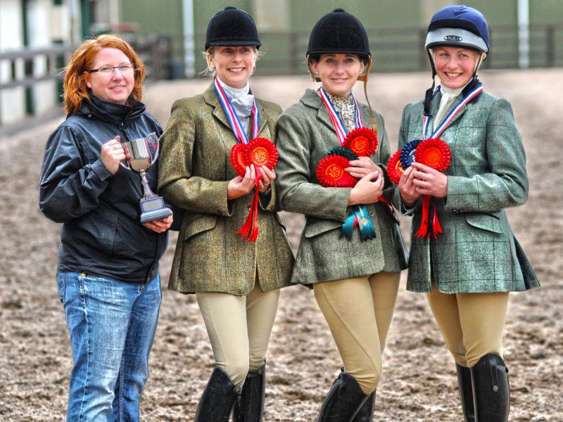 women winners of a horse riding show.