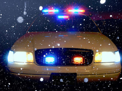 police car in snow storm
