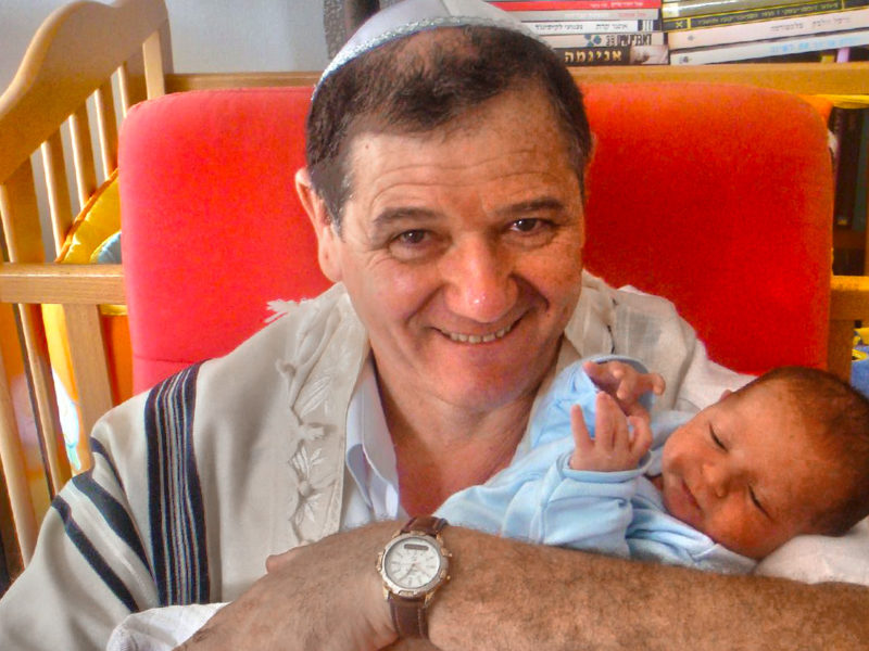 Jewish father and 8-day-old son.