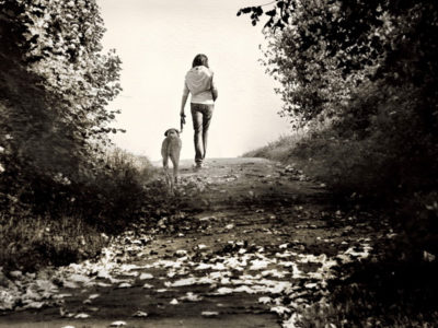 Woman walking a dog