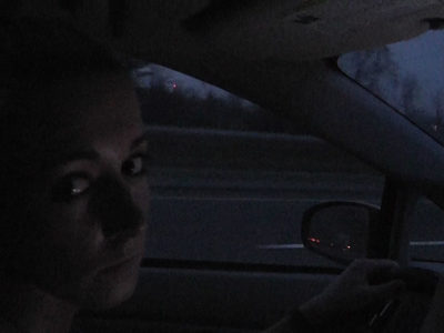 woman driving car at night