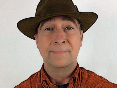 Stephen M. Miller wearing fedora
