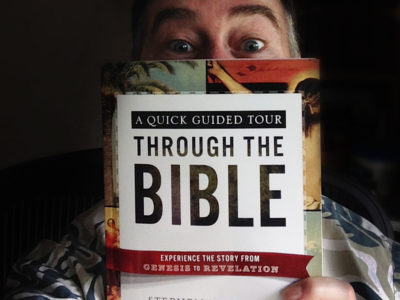 Stephen M. Miller holding his newest book, A Quick Guided Tour Through the Bible