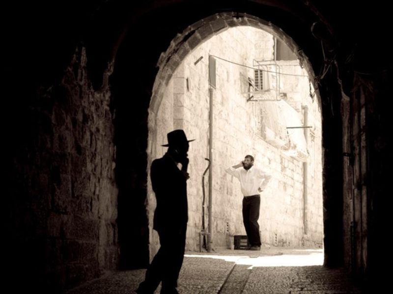 Orthodox Jews talking on cell phones in Old City of Jerusalem