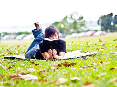 young woman reading Bible