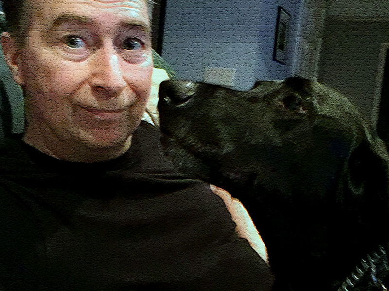Stephen M. Miller with Mosby, a black lab