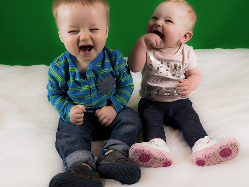 two babies laughing