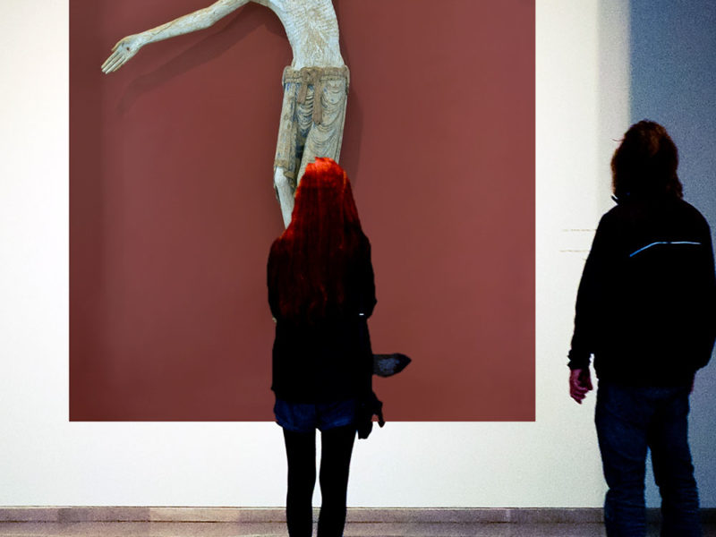 people looking at art of Crucifixion of Jesus