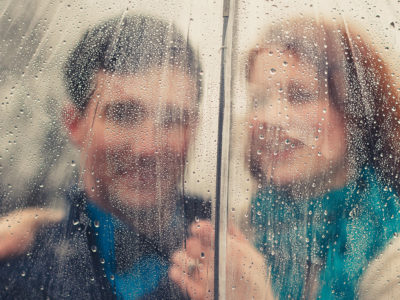 Engagement photo of couple in the rain.