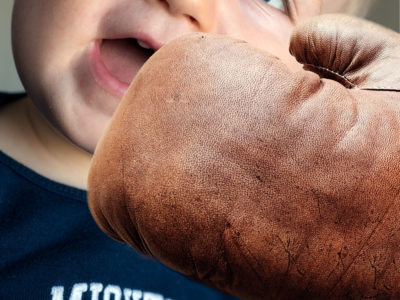 Toddler with boxing glove