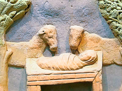 stone carving of Baby Jesus in a feeding trough