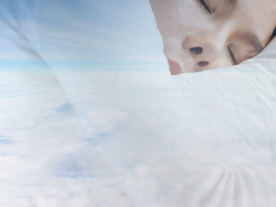 photo of sleeping woman in clouds