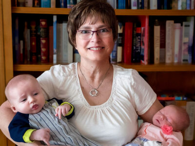 woman with two baby grandchildren.